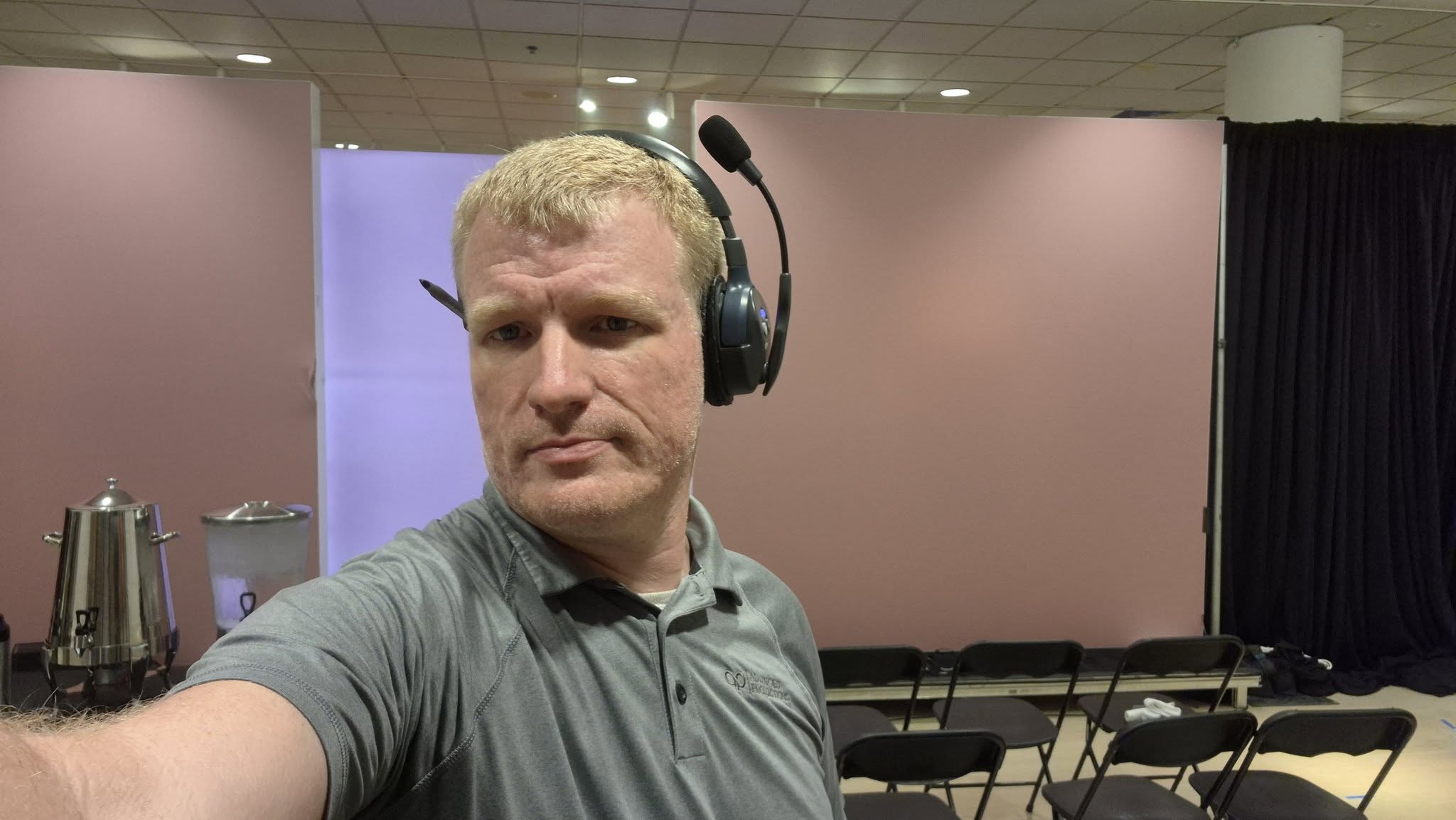 Cedric Harris wearing a production headset at an event