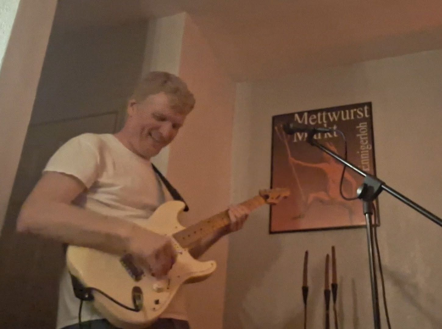 Cedric Harris playing electric guitar