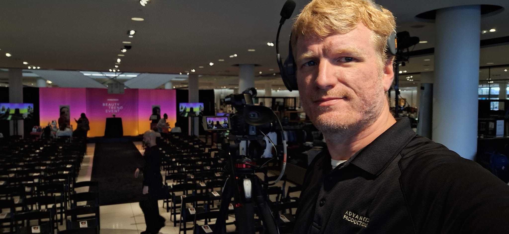 Cedric Harris working behind a video camera at a live production